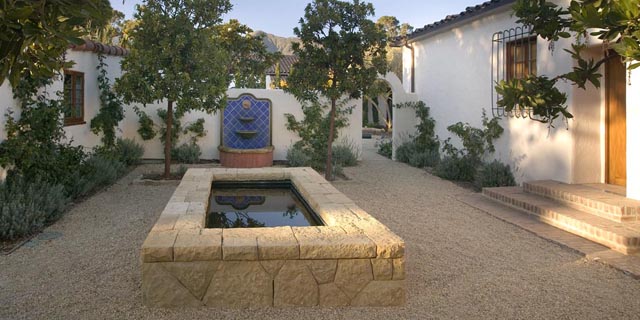 Koi pond with a seating wall in the interior courtyard.